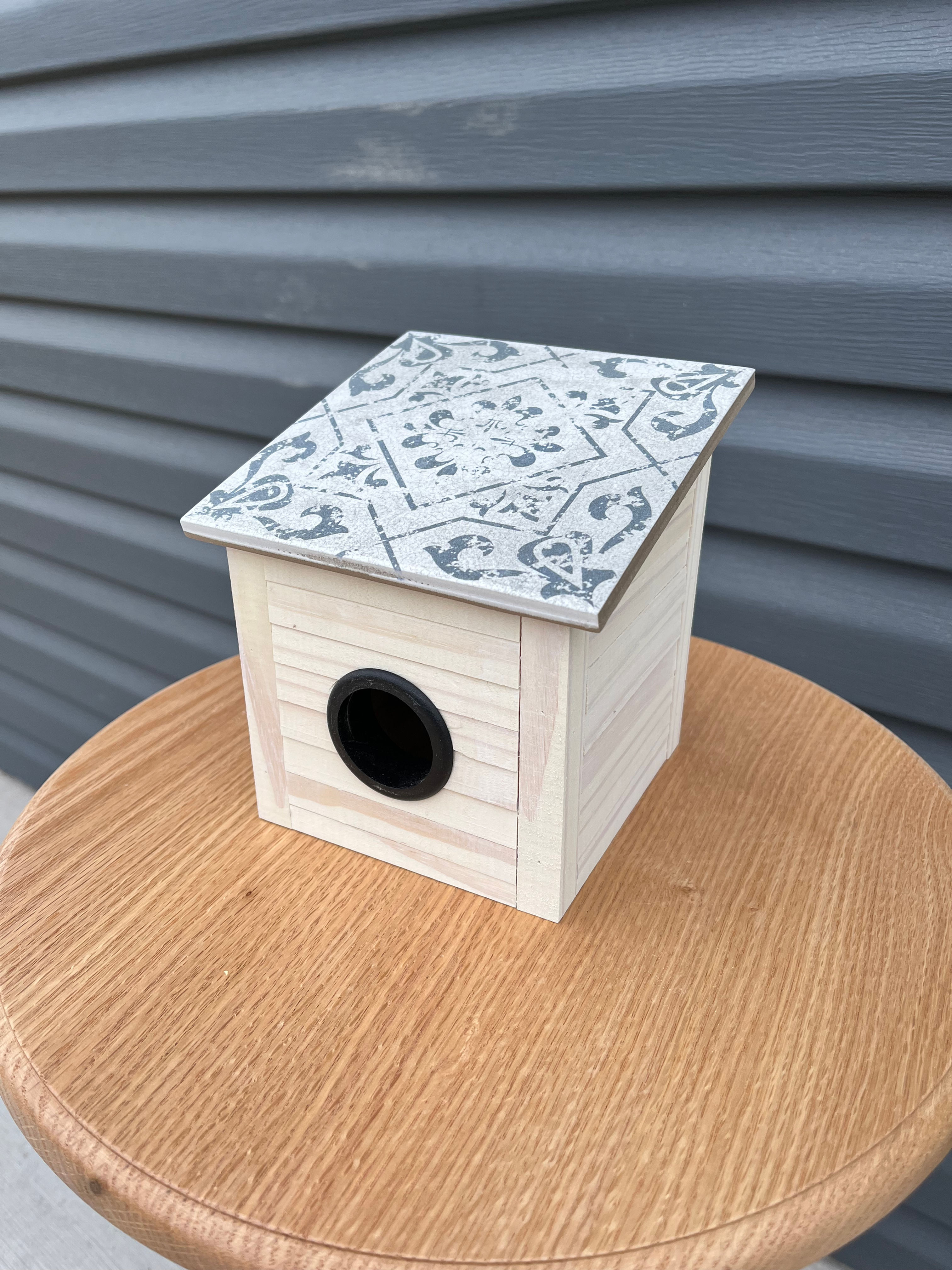 5x5x6h pine birdhouse with tile roof and pine construction.