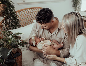 New Parents Ash & Kyle who completed the Journey to Birth Hypnobirthing course in Australia with Shari holding their beautiful baby girl