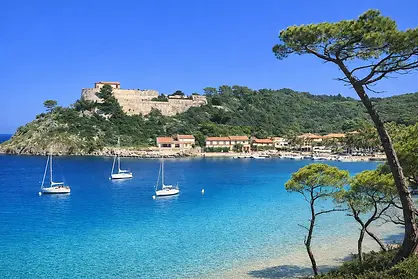 Luxury Yacht Charter – Discover Porquerolles: Stunning views overlooking the beautiful harbor town, the vibrant waterfront, and the coastline.