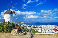 Mykonos windmill and Chora — luxury yacht charter Greek islands Aegean.