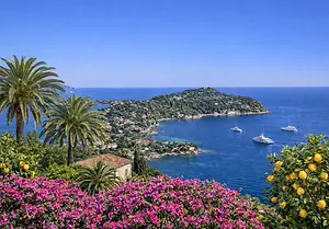 Luxury Yacht Charter – Experience Saint Cap Jean Ferrat: Stunning views overlooking the beautiful harbor town, the vibrant waterfront, and the coastline.