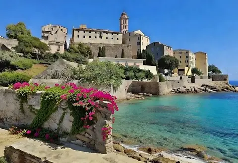 Luxury yacht charter – scenic views across the harbor of Bastia under bright sunshine on a clear day.