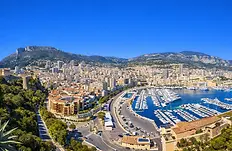 Luxury Yacht Charter – stunning impressions overlooking the beautiful harbor town Monte Carlo and its vibrant waterfront.