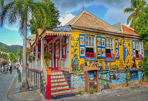 Discover St. Martin - Caribbean Life -Luxury bareboat sailing yachts and catamarans sailing in the turquoise waters of Marigot Bay in Saint Martin.