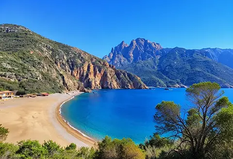 Luxury bareboat sailing yachts and catamarans navigating the spectacular waters of the Gulf of Porto along Corsica’s scenic coastline.