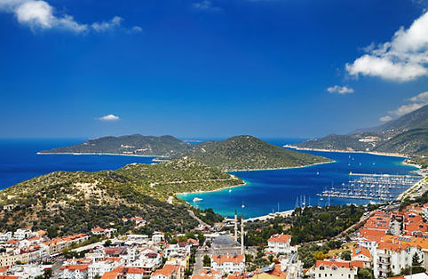 Luxury bareboat sailing yachts and catamarans anchored in the beautiful Kas harbor in Turkey.