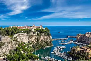 Luxury Yacht Charter – Discover Monte Carlo: Stunning views overlooking the beautiful harbor town, the vibrant waterfront, and the coastline.