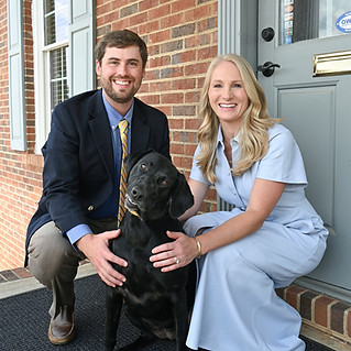 Our dentist, Dr. Tumlin, with his wife Emily, and dog Molly.