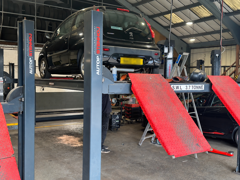 Hatchback on a Red-Ramp Lift.png