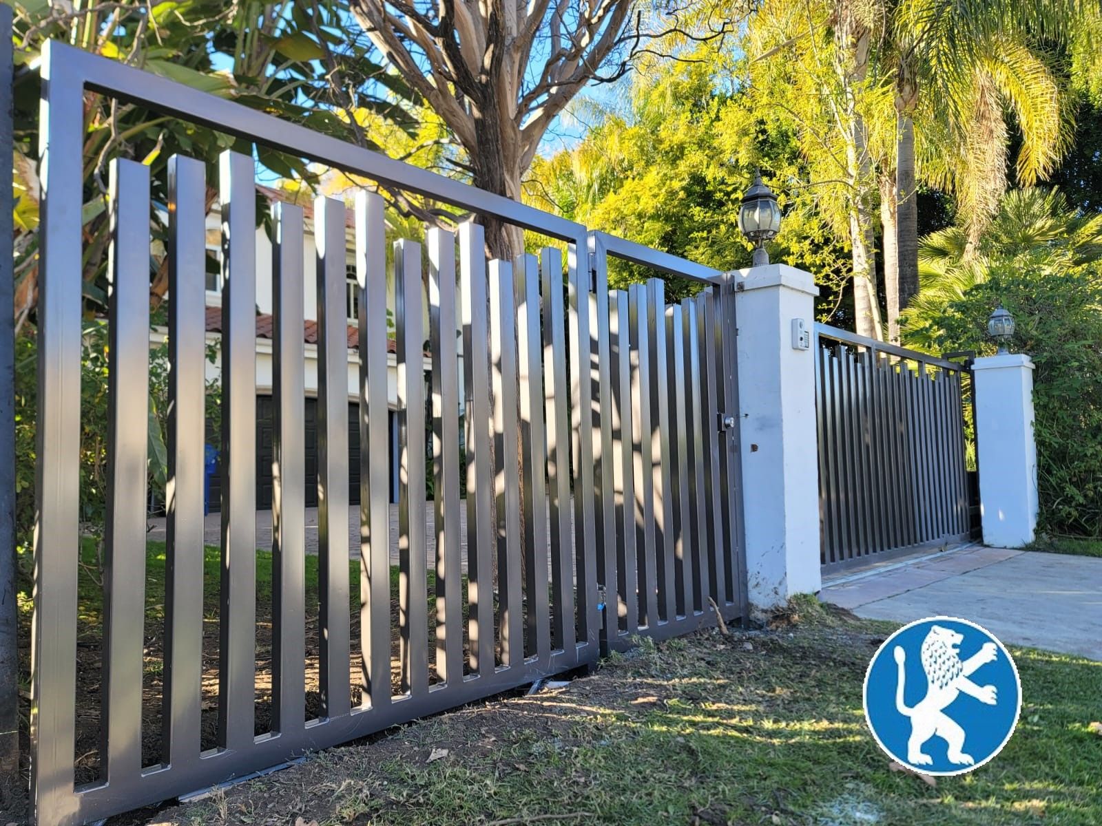 Custom Vertical Cut Iron with Matching Pedestrian & Driveway Gate.jpg