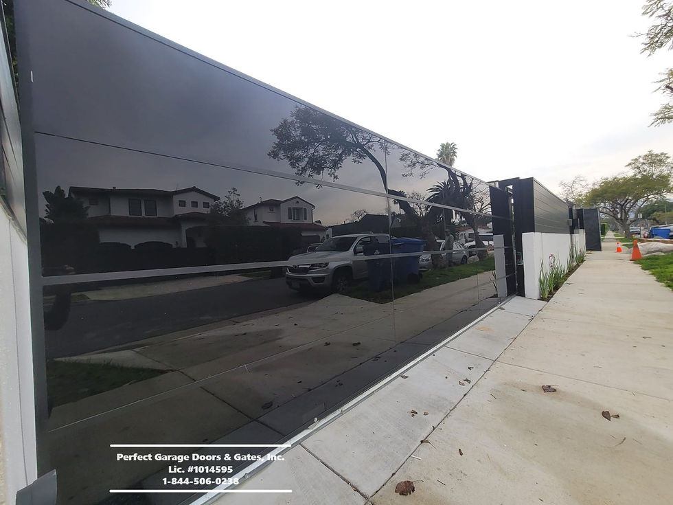 Custom Contemporary Tinted Glass Sliding Drieway Gate.jpg
