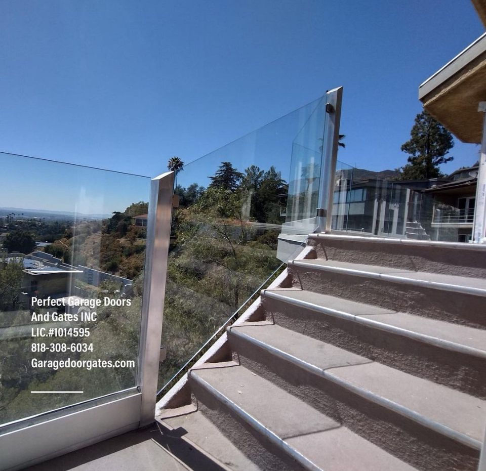 Custom Frameless Glass Stair Railing with Iron Posts.jpg