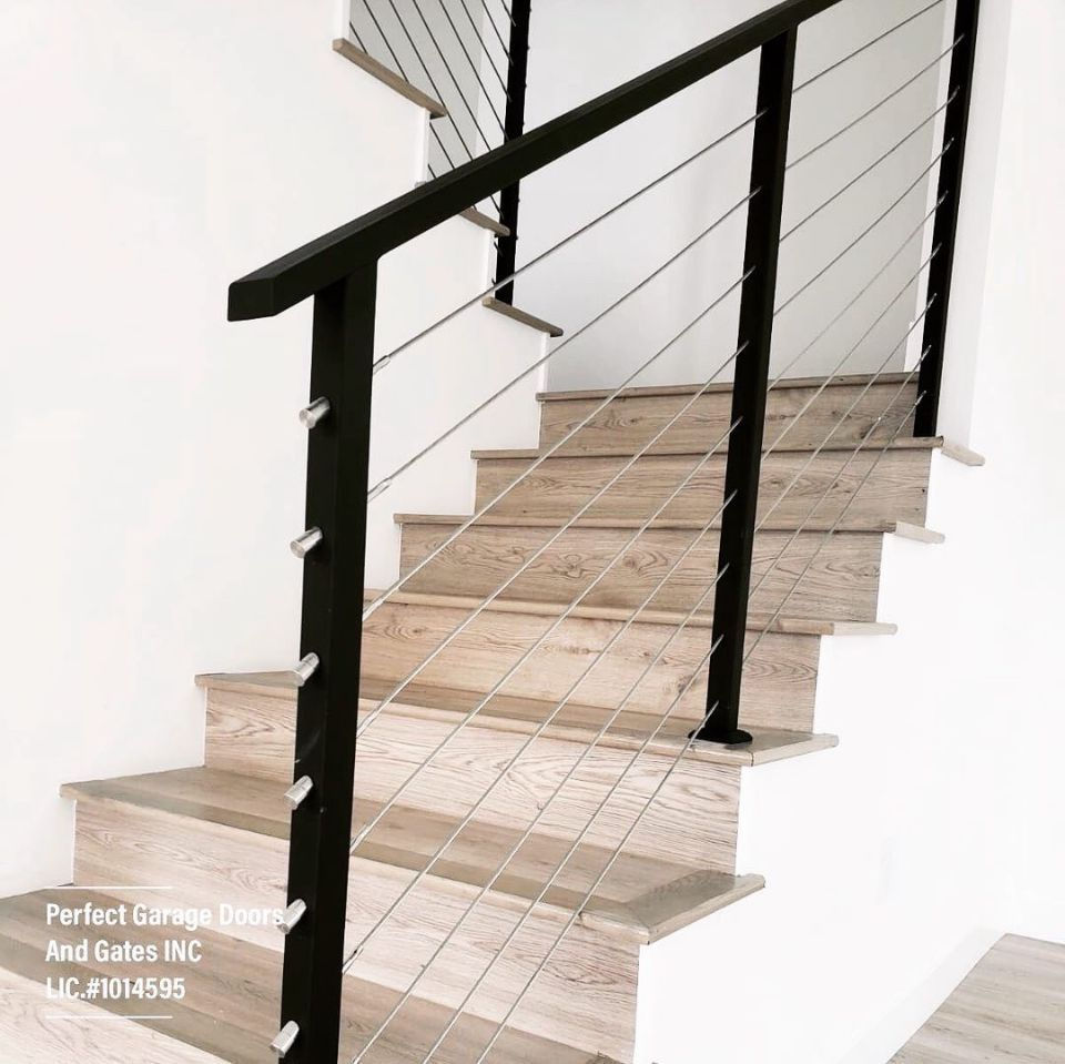 Custom Stainless Steel Cable Interior Stair Railing with Iron Posts and Top Rail.jpg
