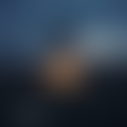 A burning but peaceful altar in a field at dawn