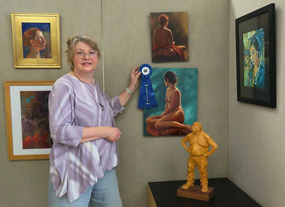 Barbara showing of her Best of Show award at the Essential Figure Show