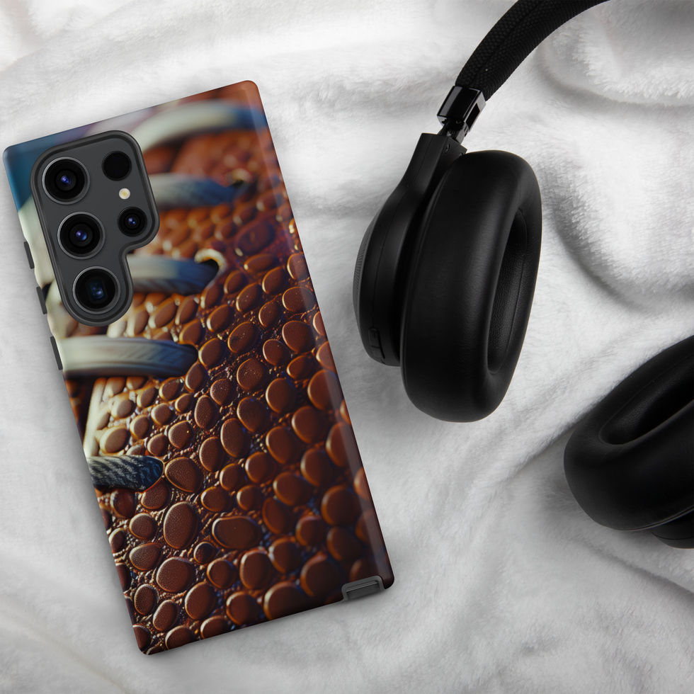 Gridiron Grip Tough case for Samsung Galaxy S23 Ultra, football laces artwork beside headphones on pale fabric.