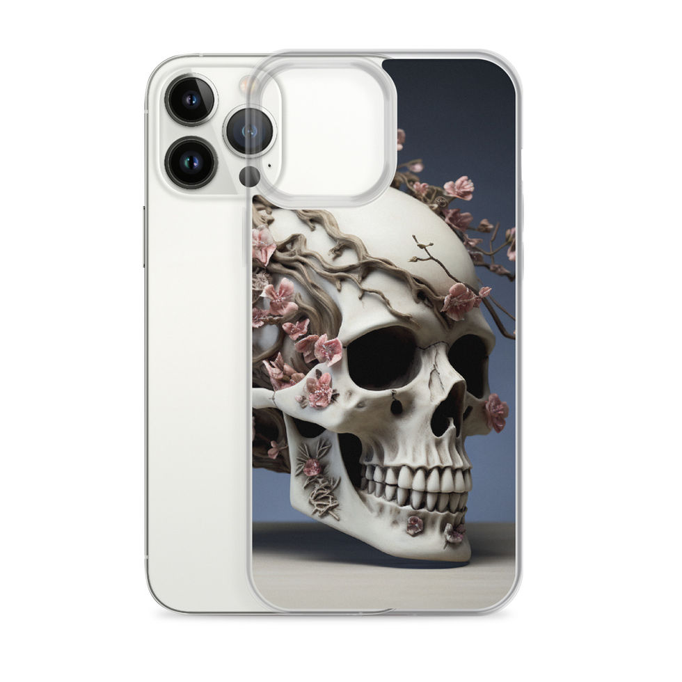 Product mockup of the Ethereal Bloom clear case displaying a bone-white skull and soft rose-coloured blooms