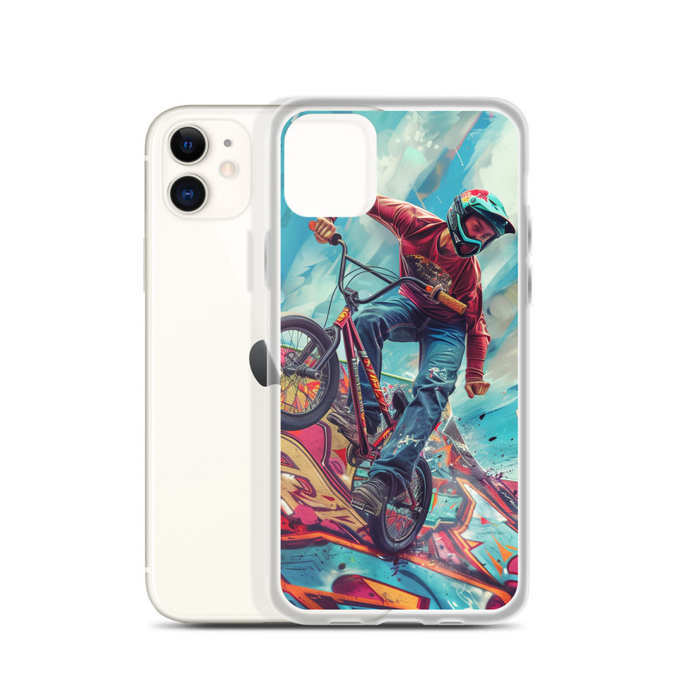 Ramp Rebel Clear case for iPhone 11, red-jacketed BMX rider and graffiti, phone beside case on white