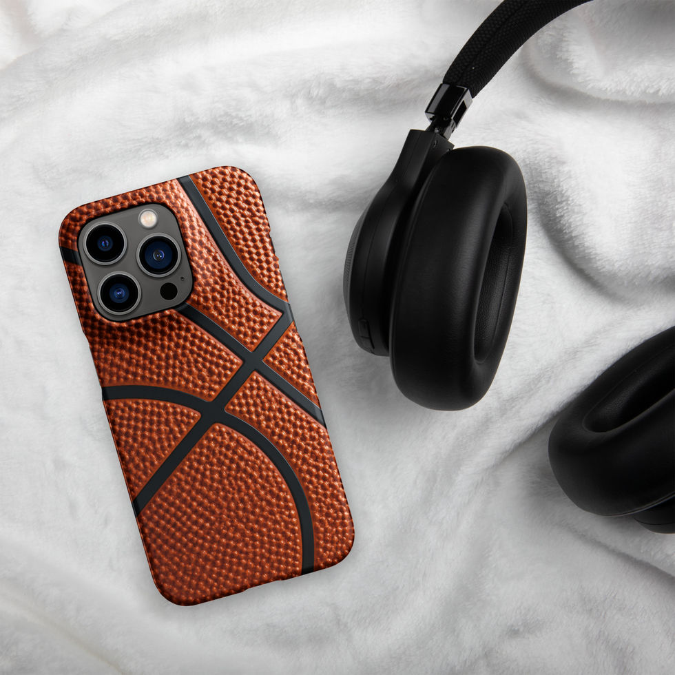 Full Court Grip Snap case for iPhone 14 Pro, orange basketball texture and black seams, headphones on pale cloth