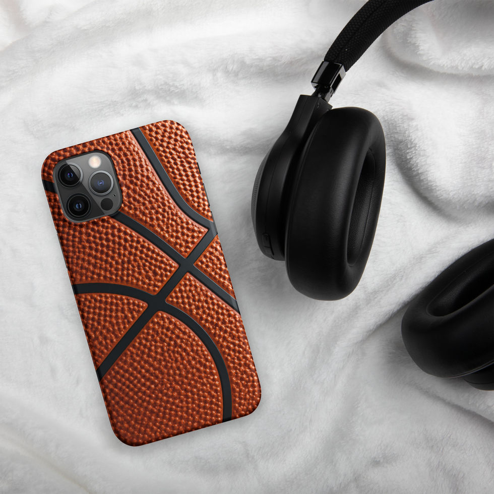 Full Court Grip Snap case for iPhone 12 Pro, orange basketball texture and black seams, headphones on pale cloth