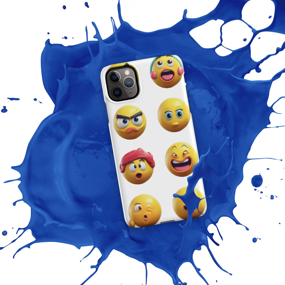 Emoji Frenzy snap iPhone case showing smiling and startled emojis across its rear print, over a blue paint splash.