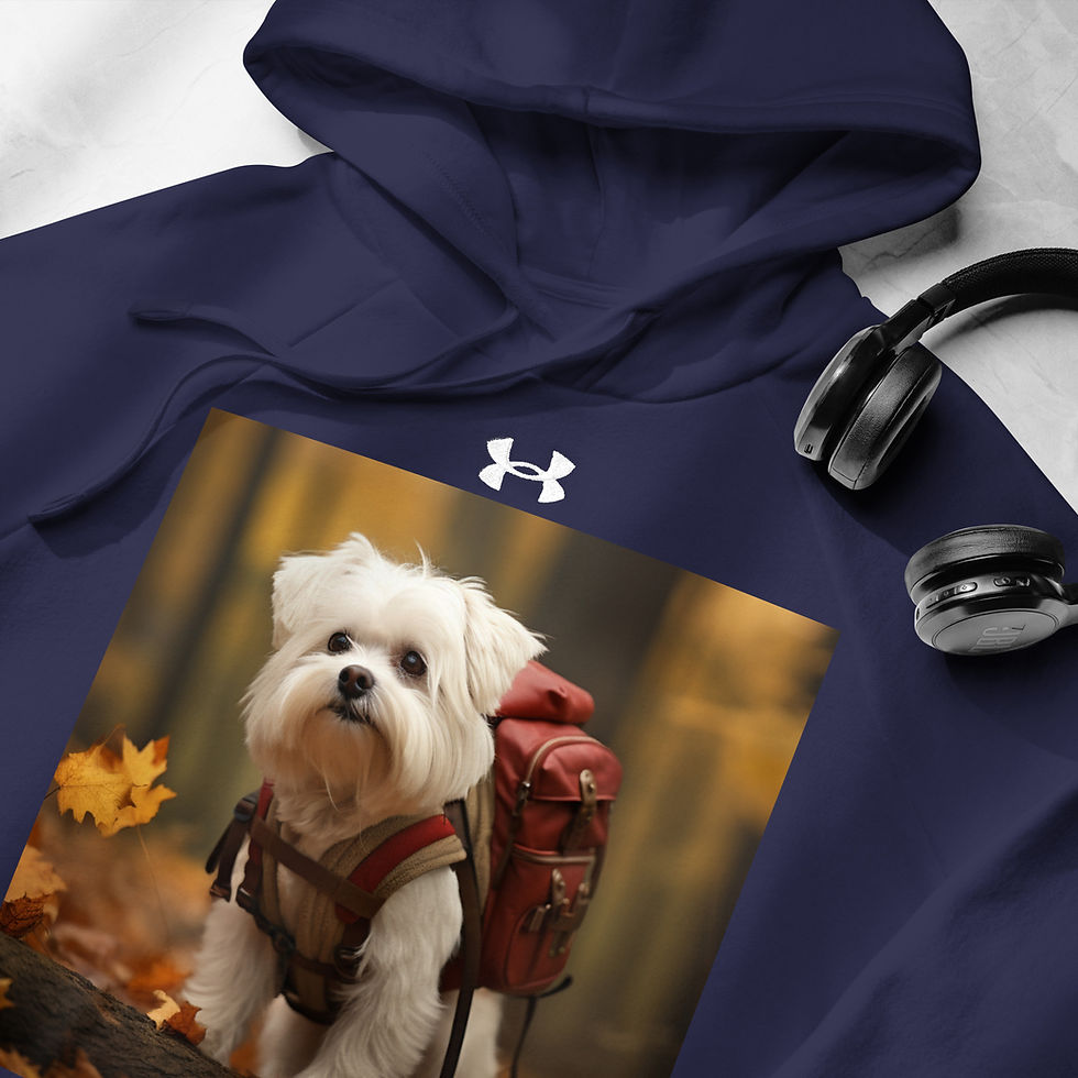 Adventurer Pup: navy Under Armour hoodie with a white puppy with a backpack, laid beside headphones