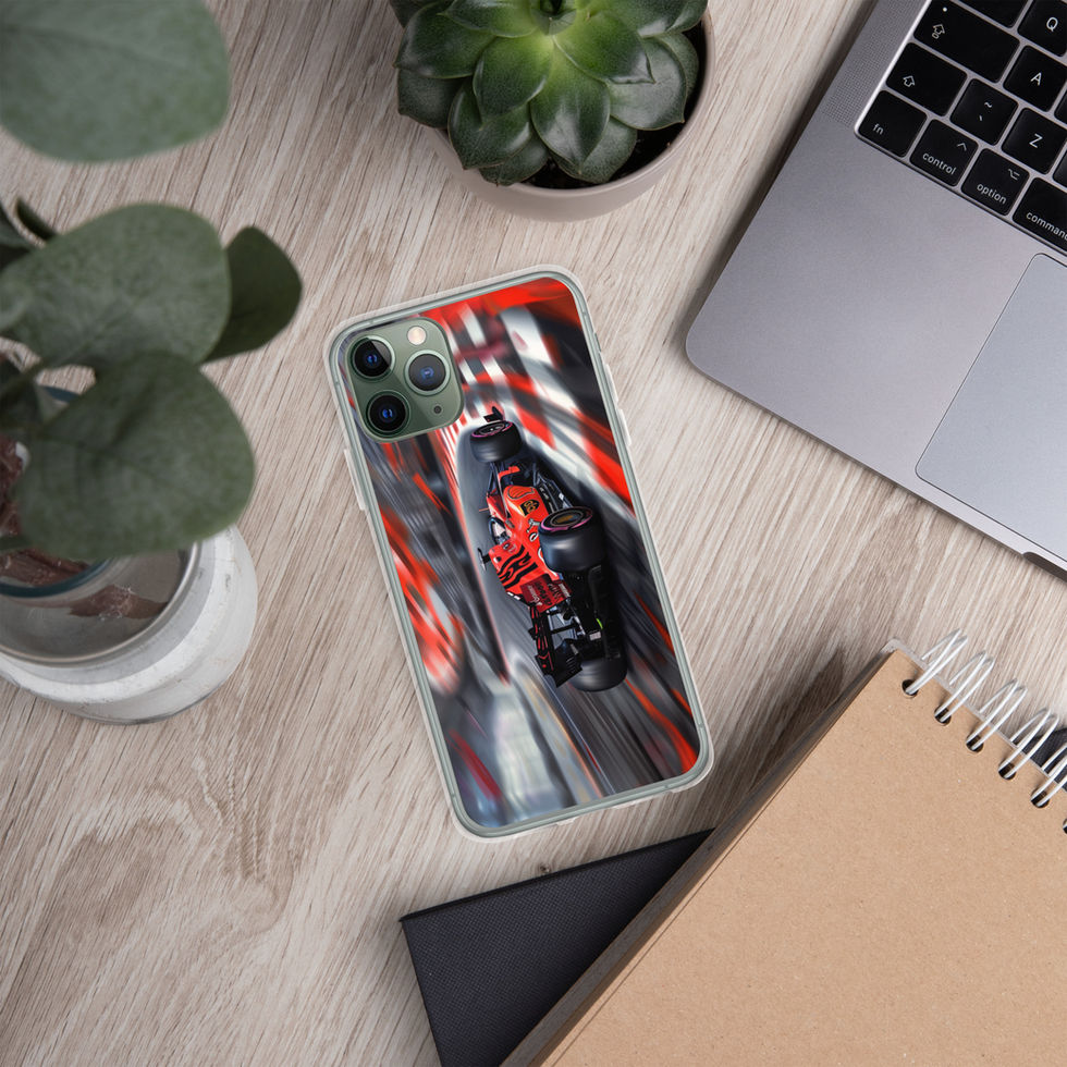 Apex Velocity Clear case for iPhone 11 Pro, red race car and track streaks, on light desk with laptop and plants