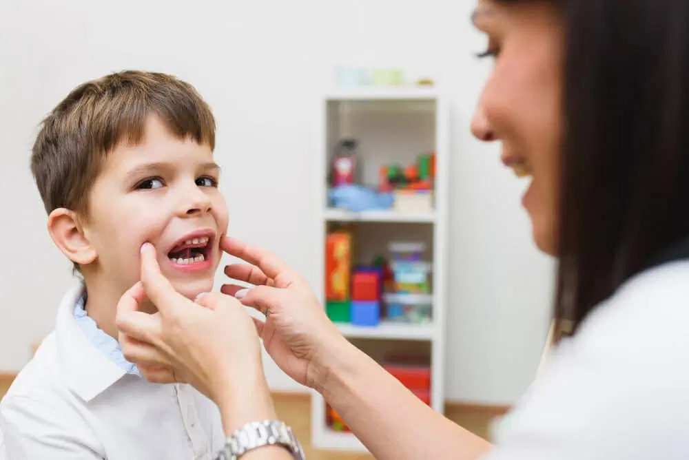 beautiful-woman-speech-therapist-deals-with-boy-teaches-him-correct-pronunciation-competen