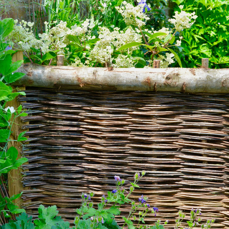 Willow Fencing, Hurdles and Panels. Sustainable, handmade and harvested wicker fencing by Professional Basketmakers Jenny Crisp and Issy Wilkes, Willow with Roots, Chestnut Hurdle