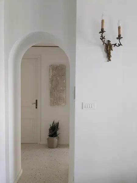 Modern arched doorway in a villa in a retreat in the South of France.