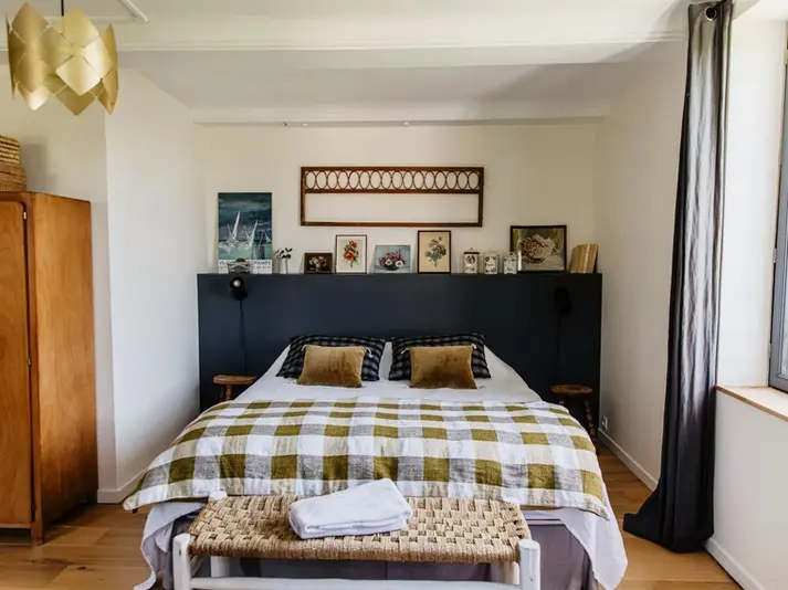 Neutrally decorated bedroom at Maison Pomme Normandy retreat