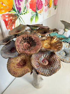 Buy Sanaz Busink unique handcrafted custom pottery flowers designed to catch rain water to hydrate bees.