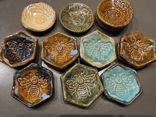 Buy Sanaz Busink unique handcrafted custom pottery ramekins to hold small items such as jewelry, or as a tea bag holder.  Bee designs.