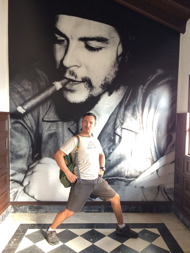 Peter standing in front of a Che Guevara mural in Cuba