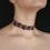 Thumbnail: Front view of Grey Beaded Choker Necklace with Pomegranate Ornament, showing deep red pomegranate pattern on soft grey base.