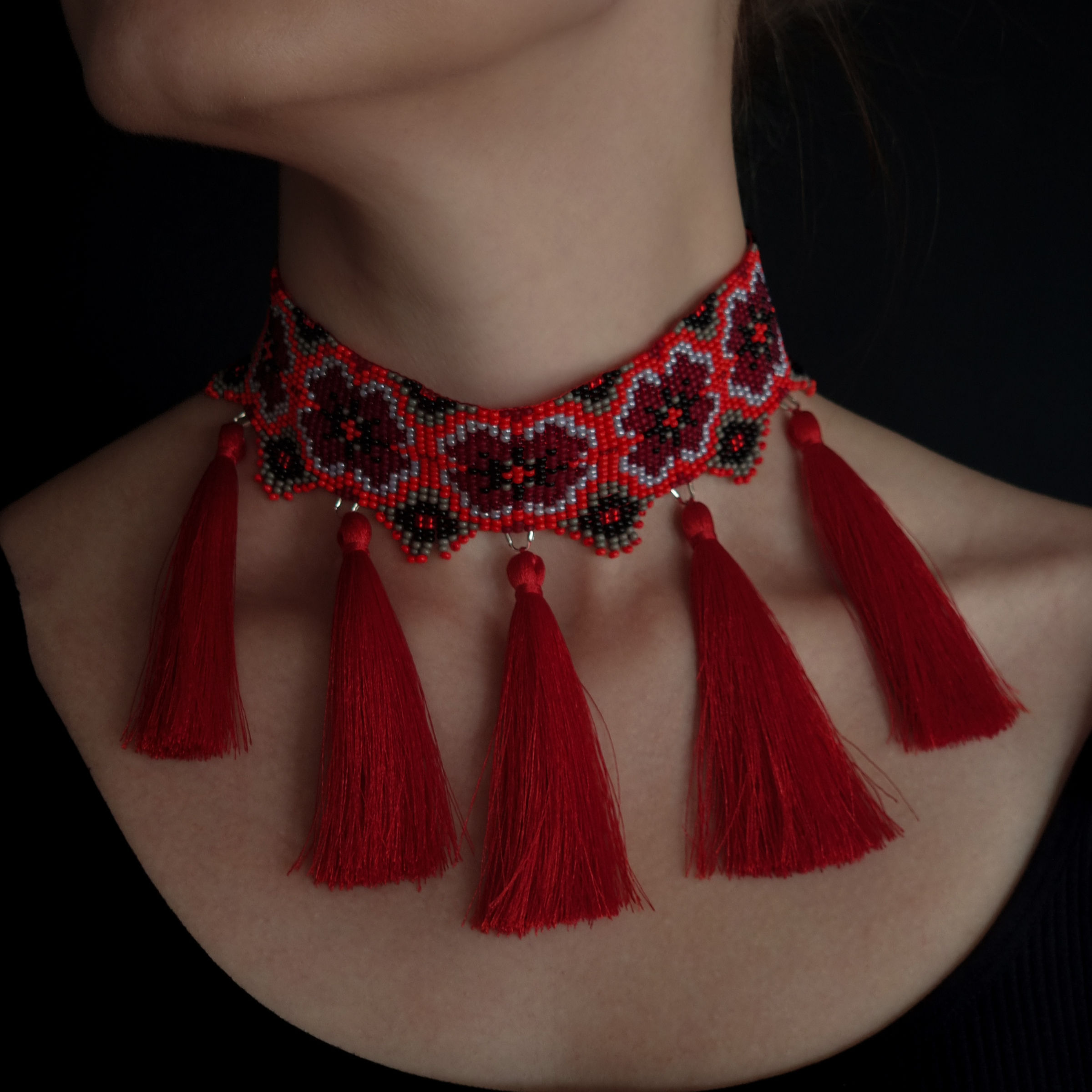Red Beaded Choker Necklace – Stunning red necklace with tassels, front view.