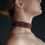 Thumbnail: Side view of Wide Brown Necklace emphasizing its structured fit on the neck.
