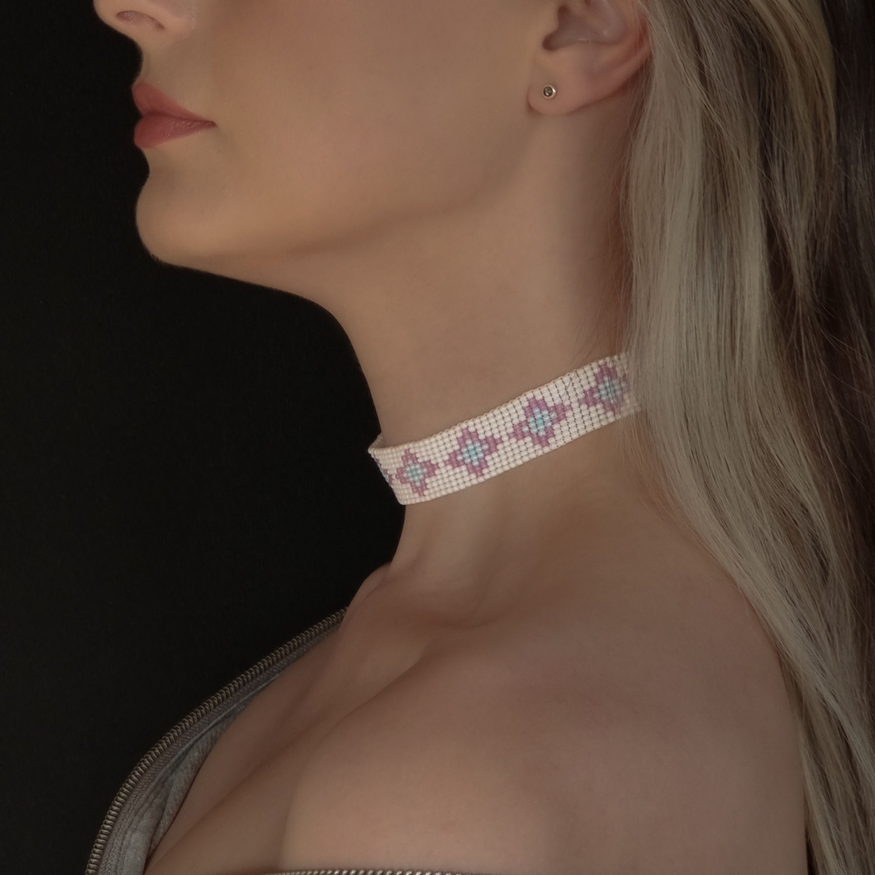 Side profile of the thin white choker, emphasizing its minimalist elegance and style.