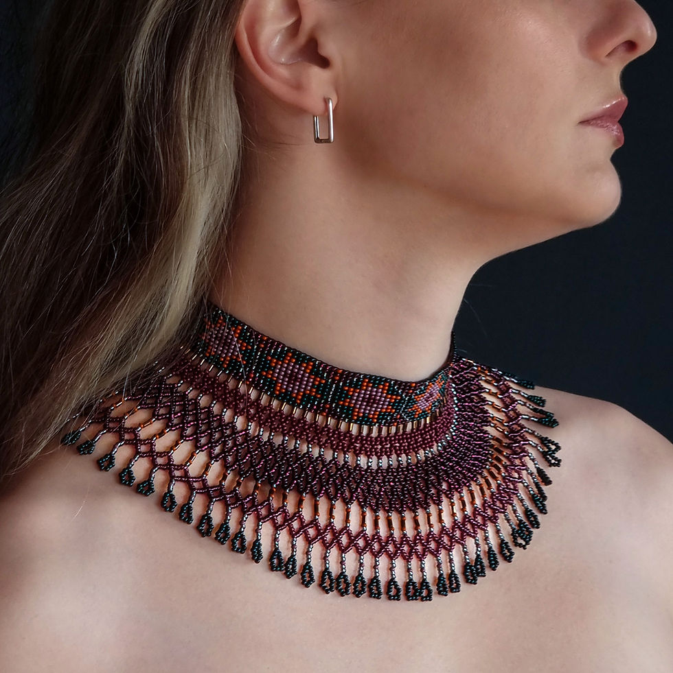 Handmade burgundy collar necklace with cascading beaded fringe and ornamental design.