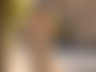 A woman carrying flowers along a Paris street