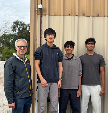 Dr. Kozminski, Oscar Lee, Idhant Ranjan, and Keshav Arun take a photo after setting up the PurpleAir air quality monitor at CEJA.