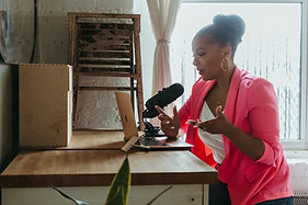 female career coach recording a podcast