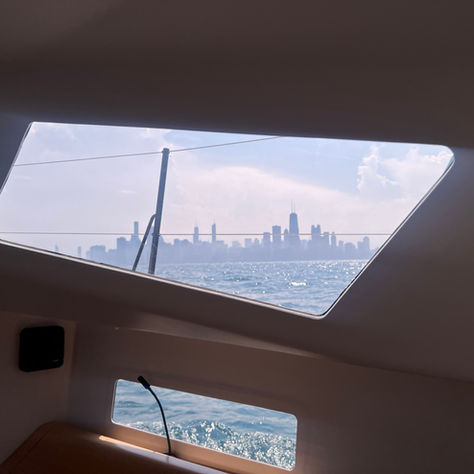 View of Chicago from the port light inside the boat