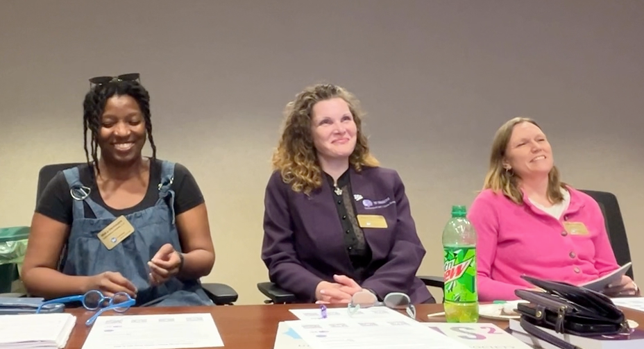 Three women laughing