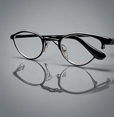 oval glasses with grey background.jpg