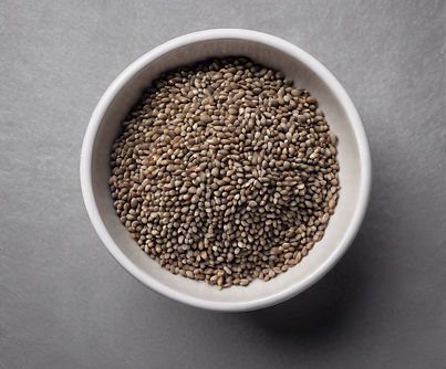 Syllium Seeds in a bowl with Grey Backgr