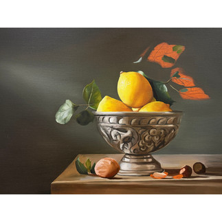 Still life oil painting of a silver ornate bowl holding bright yellow lemons with green leaves, set on a wooden surface with scattered walnut shells.