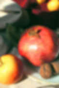 photograph of apple, pomegranate and walnut by olesia bahrii from unsplash