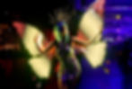 Close-up of a dynamic futuristic dancer, captivating the audience with their futuristic moves at Dragon Talent Group's exclusive corporate event. Reserve your spot to witness this dance innovation!