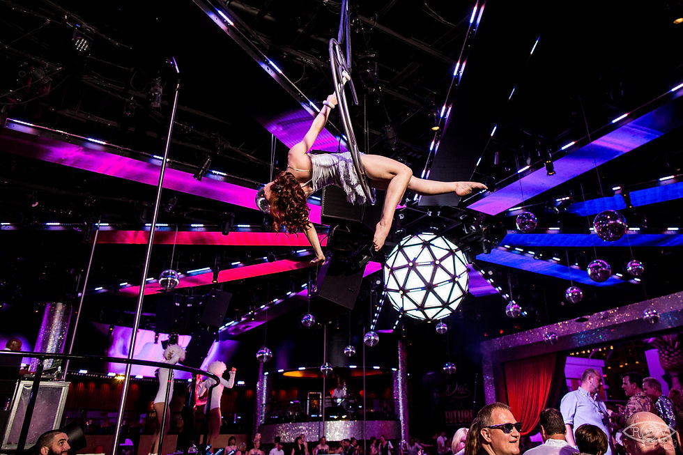 daring circus acrobat defying gravity, becoming the center of attention at private corporate entertainment hosted by Dragon Talent Group's circus-themed event. Reserve your spot for an unforgettable show!